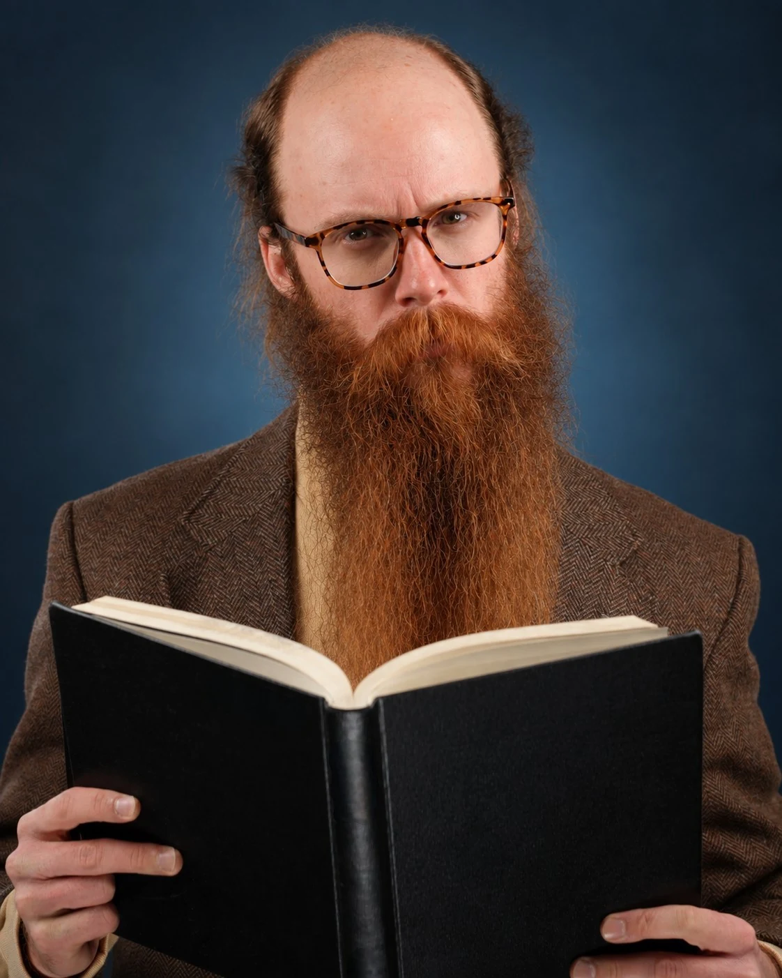 London Oliver reading a book in glasses