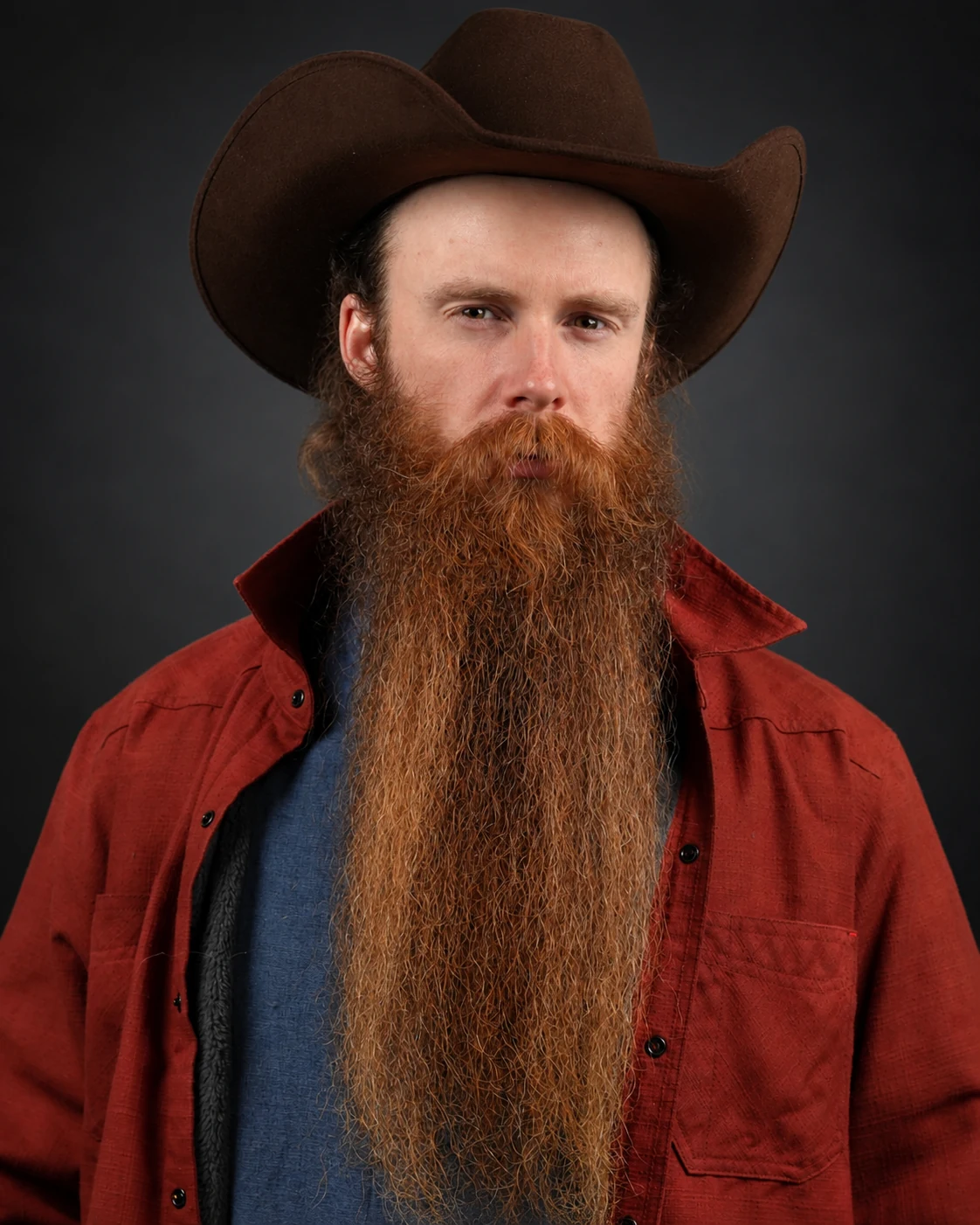 London Oliver in a cowboy hat and red shirt