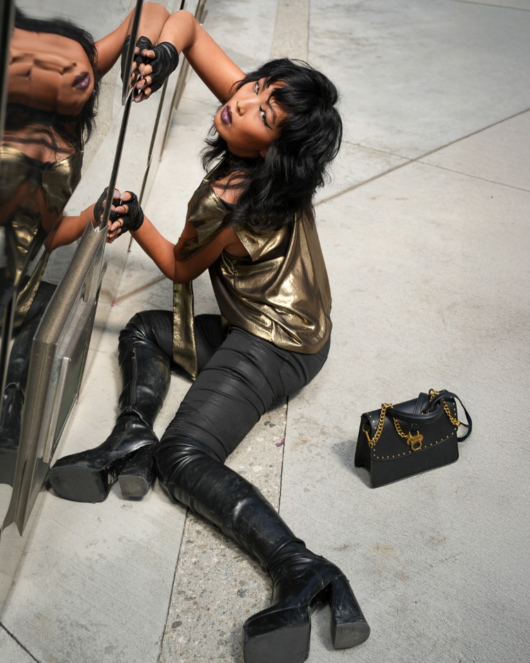Fashion portrait beside a mirrored wall