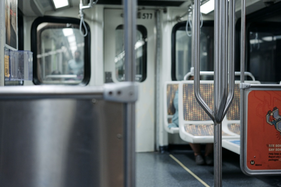 Subway train interior with polished chrome poles and seats