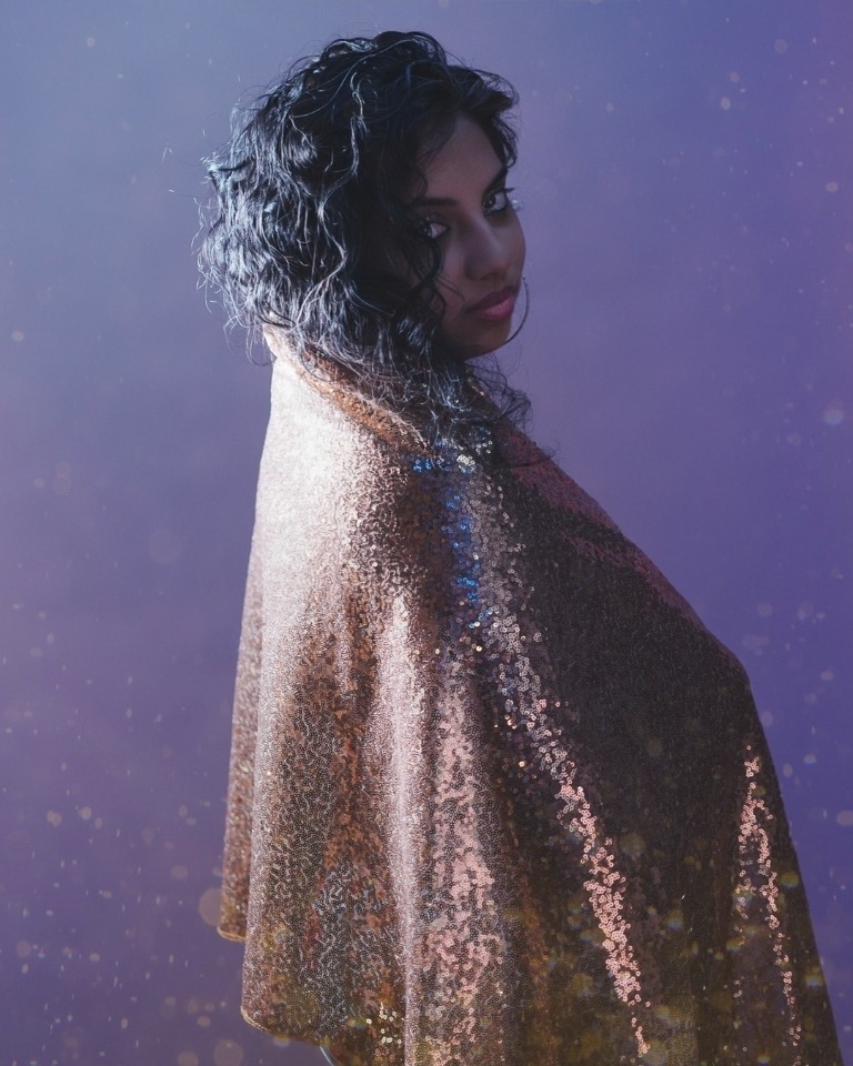 Fashion portrait in a shimmering silver look
